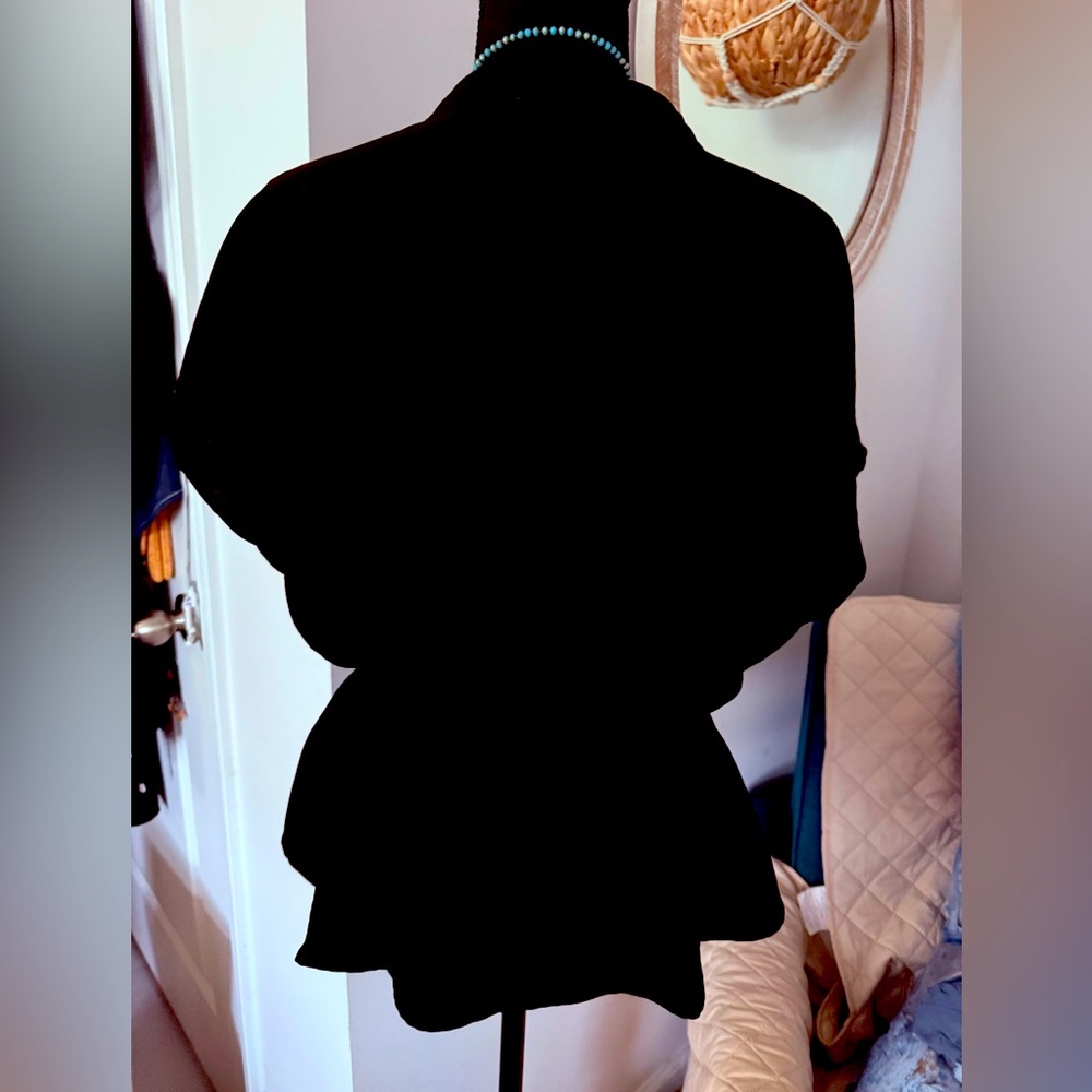 This is like new black top with a tie waist and buttons. - Picture 2 of 4